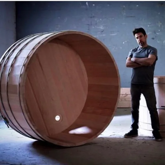 John Cox perfecting the stainless steel banding technique beside a cedar hot tub, 2009