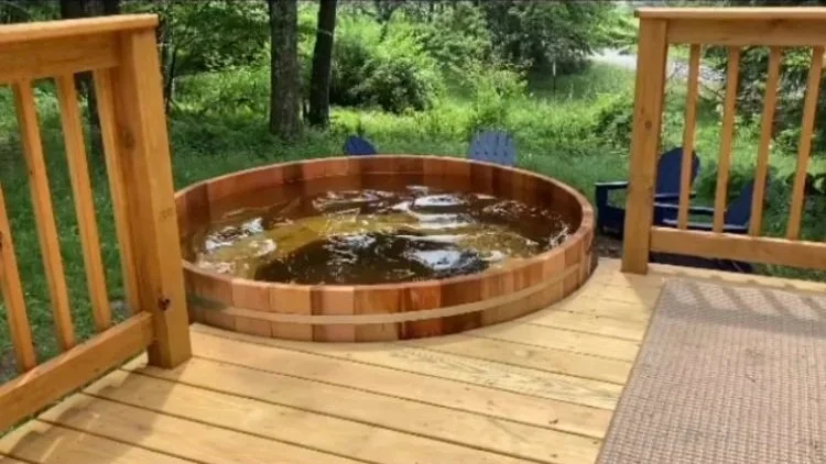 Cedar hot tub with custom cedar surround and step system