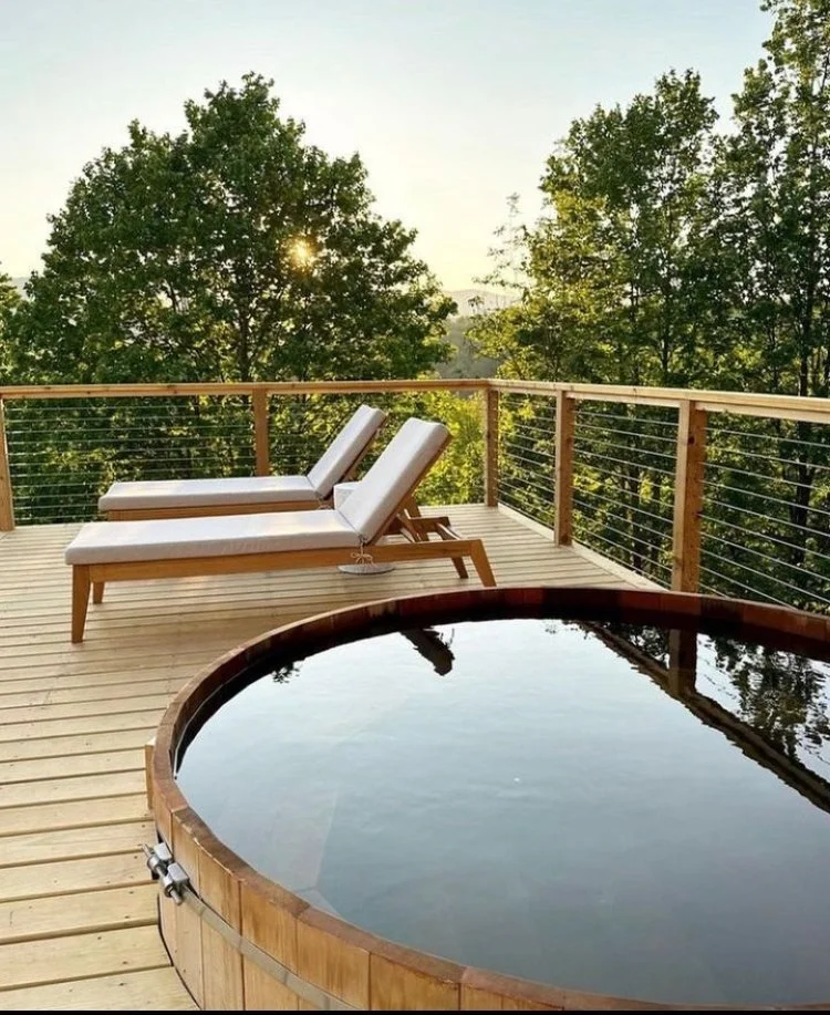 Cedar hot tub installation — full view of tub and surrounding landscape