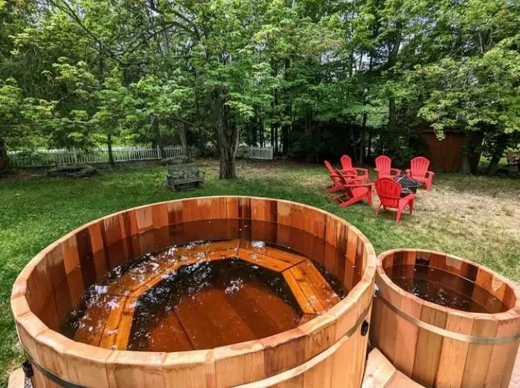 Cedar hot tub on a deck overlooking the Hudson Valley