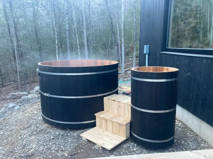 Cedar hot tub installed on a custom deck in the Hudson Valley