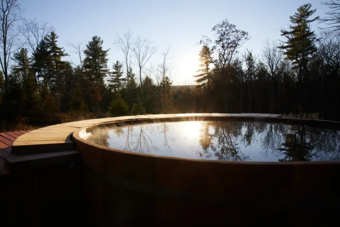 Cedar hot tub at a Hudson Valley farmhouse retreat