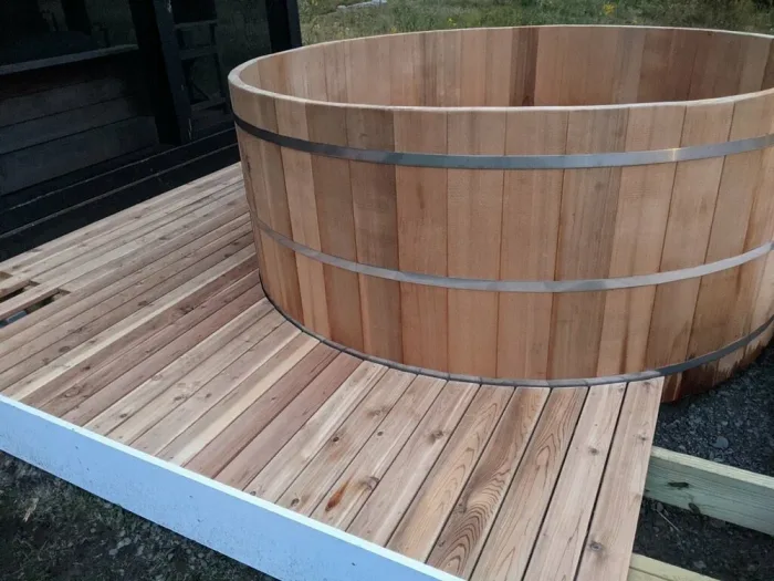 Cedar hot tub nestled in a Hudson Valley woodland clearing