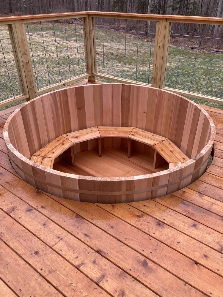 Cedar hot tub showing integrated deck installation Cedar hot tub showing integrated deck installation